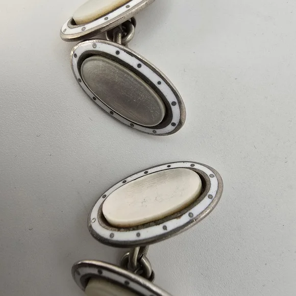 1920s antiqie mother of pearl and white enamel cufflinks.